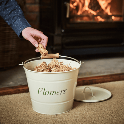 Flamers and KindleFlamers storage buckets in front of woodburning stove