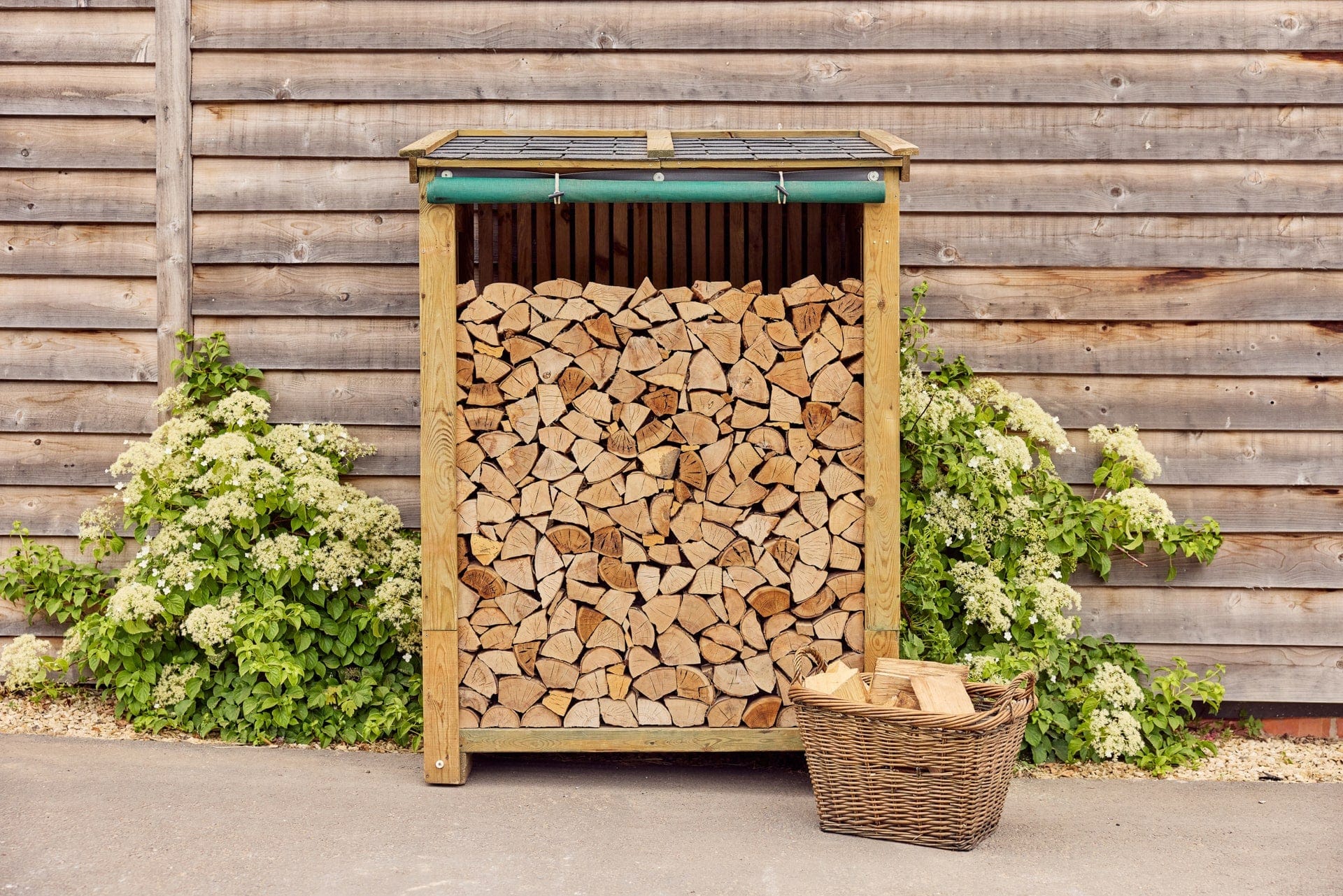 Log store with felt tiled roof slatted sides Certainly Wood